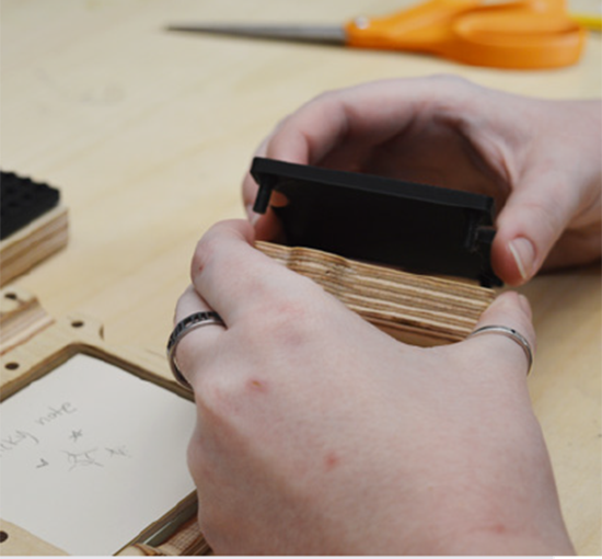 hands assembling Basis organization vertically